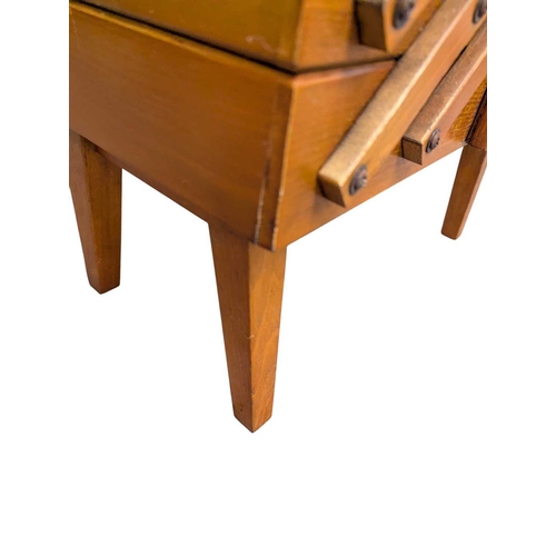 628 - British Modern Design - A mid 20th century stained teak metamorphic / cantilever sewing box / chest.... 