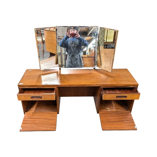 629 - White & Newton Furniture - Vintage mid 20th century teak dressing table. Knee hole centre flanke... 