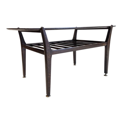 630 - British Modern Design - Mid century teak wood coffee occasional table raised on shaped legs with mag... 