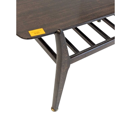 630 - British Modern Design - Mid century teak wood coffee occasional table raised on shaped legs with mag... 