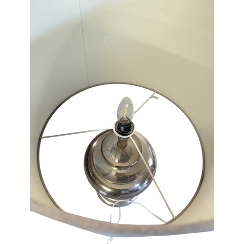 634 - Pair of contemporary polished silver metal table lamps. Having grey conical shades on silver bulbous... 