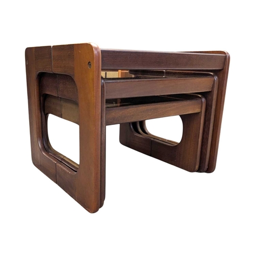 640 - British Modern Design - A vintage 20th century teak and smoked glass nest of tables. Rectangular for... 