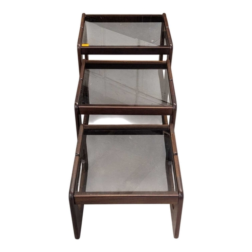 640 - British Modern Design - A vintage 20th century teak and smoked glass nest of tables. Rectangular for... 