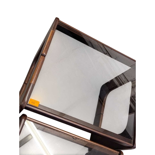 640 - British Modern Design - A vintage 20th century teak and smoked glass nest of tables. Rectangular for... 