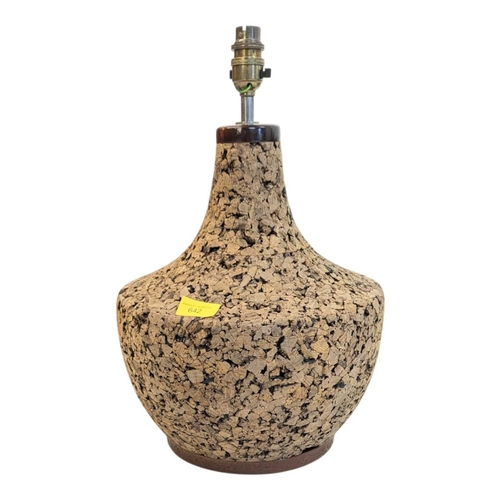 642 - A vintage mid 20th century Scandinavian circa 1970s cork table lamp. Having teak top and base with c... 