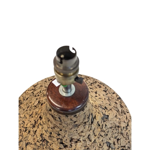 642 - A vintage mid 20th century Scandinavian circa 1970s cork table lamp. Having teak top and base with c... 