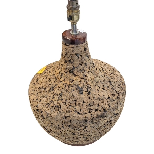 642 - A vintage mid 20th century Scandinavian circa 1970s cork table lamp. Having teak top and base with c... 