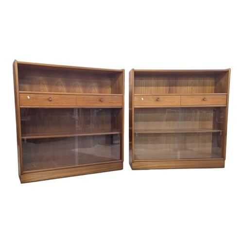644 - Two Nathan (now Parker Knoll) teak bookcases, each having two central drawers adding to the appeal o... 