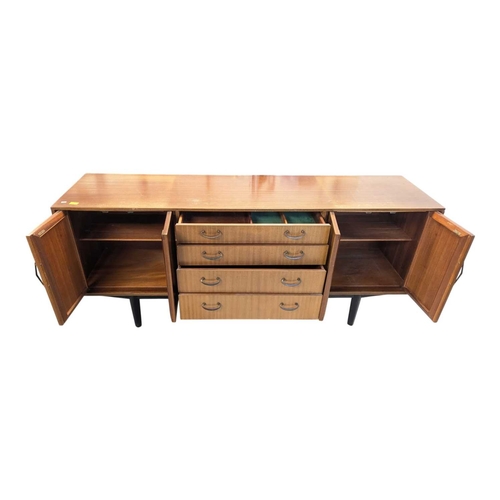 646 - A mid-century British design teak sideboard, consisting of a central bank of 4 drawers with double p... 
