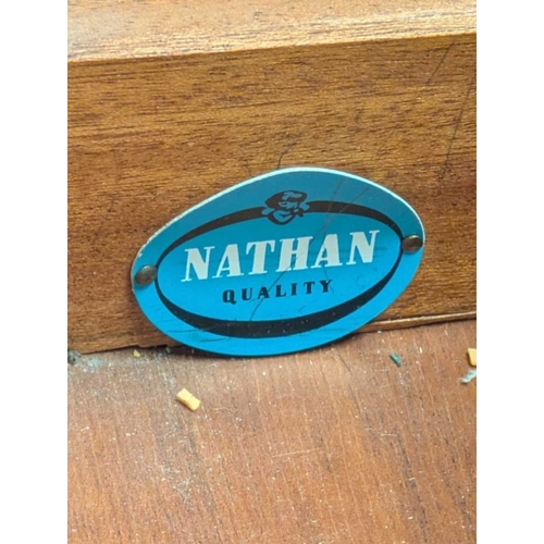 646 - A mid-century British design teak sideboard, consisting of a central bank of 4 drawers with double p... 