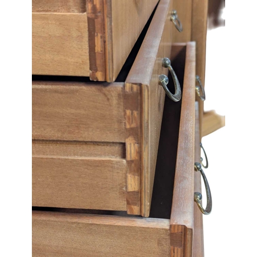 646 - A mid-century British design teak sideboard, consisting of a central bank of 4 drawers with double p... 