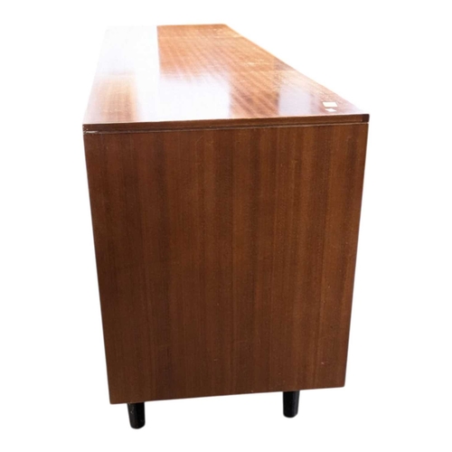 646 - A mid-century British design teak sideboard, consisting of a central bank of 4 drawers with double p... 
