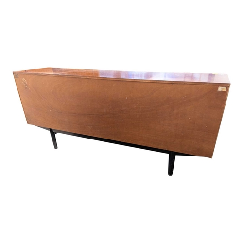 646 - A mid-century British design teak sideboard, consisting of a central bank of 4 drawers with double p... 