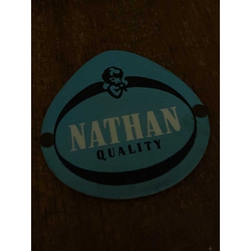 648 - A mid-century British design tola wood coffee table with ebonised legs and slatted magazine rack bel... 