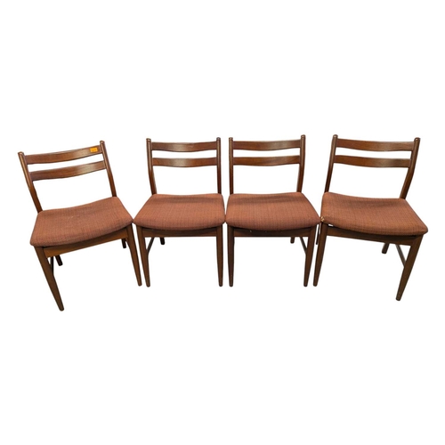 649 - British Modern Design - Set of four mid century teak dining chairs. Angled back splats with padded s... 