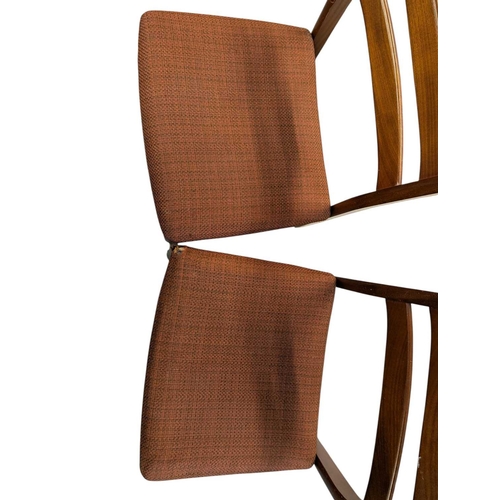 649 - British Modern Design - Set of four mid century teak dining chairs. Angled back splats with padded s... 