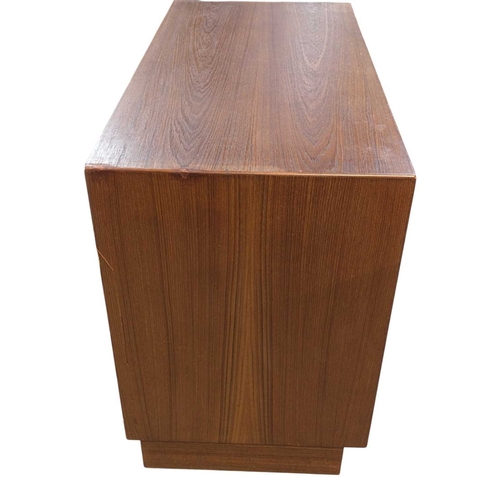657 - Danish Modern Design - A mid 20th century circa 1960 Danish teak sidebaord. The sideboard having twi... 