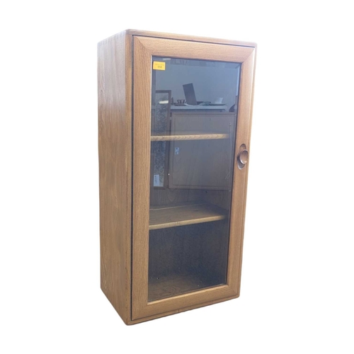 658 - Lucian Ercolani designed Ercol Windsor wall cabinet in solid elm having signature dovetail joints to... 