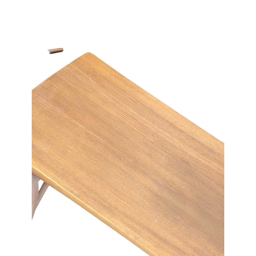 659 - Oak contemporary coffee table. Rectangular plank form with tapeing curved legs and supports with sma... 