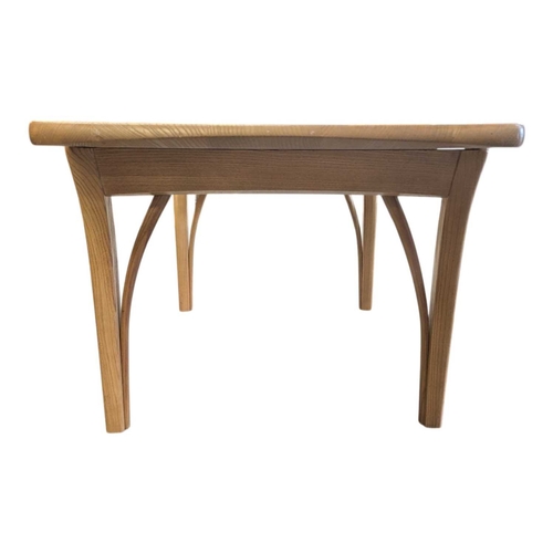 659 - Oak contemporary coffee table. Rectangular plank form with tapeing curved legs and supports with sma... 