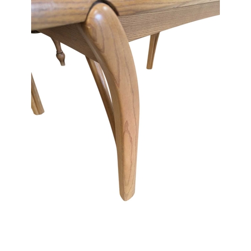 659 - Oak contemporary coffee table. Rectangular plank form with tapeing curved legs and supports with sma... 