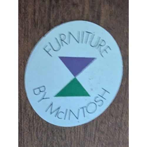 664 - Mid century teak extending dining table along with a set of 4 curved spindle back chairs having tart... 