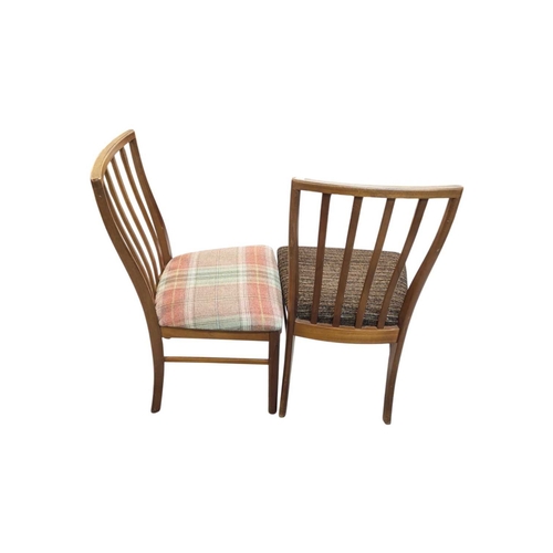 664 - Mid century teak extending dining table along with a set of 4 curved spindle back chairs having tart... 