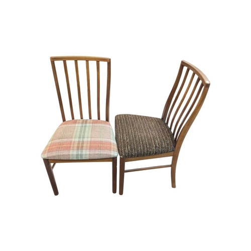 664 - Mid century teak extending dining table along with a set of 4 curved spindle back chairs having tart... 