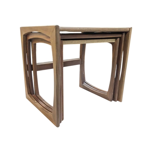 665 - G Plan Furniture - Mid century teak nest of tables. Rectangular form raised on quadrille supports wi... 