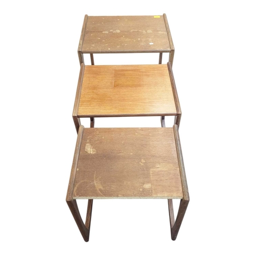 665 - G Plan Furniture - Mid century teak nest of tables. Rectangular form raised on quadrille supports wi... 