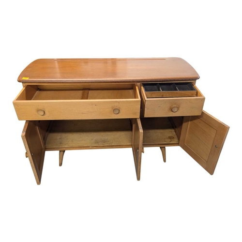 668 - Ercol Furniture - A retro mid century beech & elm sideboard credenza. Rectangular plank form wit... 