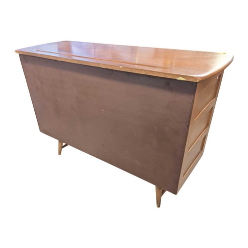668 - Ercol Furniture - A retro mid century beech & elm sideboard credenza. Rectangular plank form wit... 