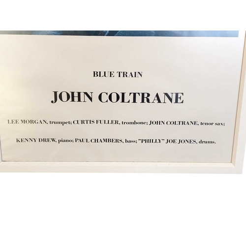 672 - A vintage 20th century John Coltrane Blue Train poster. Featuring an image of Coltrane holding micro... 