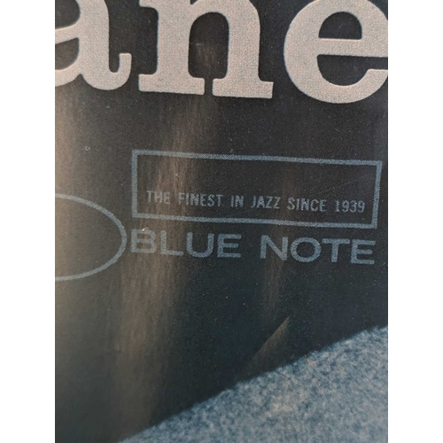 672 - A vintage 20th century John Coltrane Blue Train poster. Featuring an image of Coltrane holding micro... 