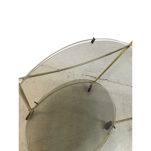 674 - A contemporary brass and smoked glass drinks / hostess trolley in the Art Deco style. Having gilt tu... 