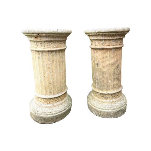 984 - A pair of early 20th century outdoor garden stone Corinthian plant stand plinths. Cicrucar form with... 