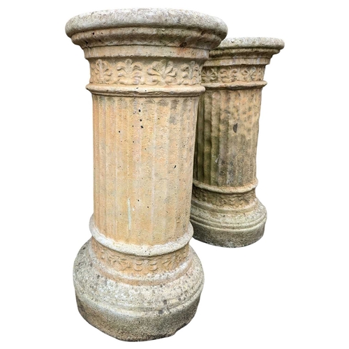 984 - A pair of early 20th century outdoor garden stone Corinthian plant stand plinths. Cicrucar form with... 