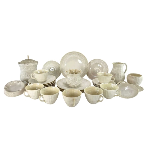 135 - A 20th century Irish Belleek lustre porcelain part tea service in the twisted shell shape. The servi... 