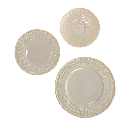 135 - A 20th century Irish Belleek lustre porcelain part tea service in the twisted shell shape. The servi... 