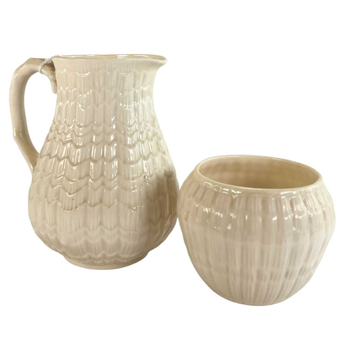 135 - A 20th century Irish Belleek lustre porcelain part tea service in the twisted shell shape. The servi... 