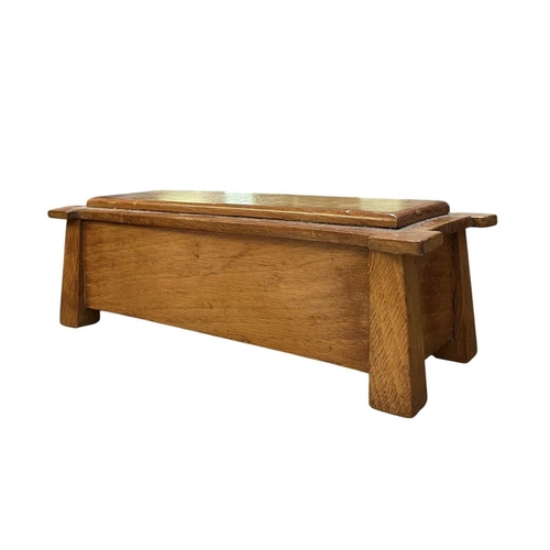 139 - An Arts & Crafts early 20th century walnut jewellery casket box in the form of a coffer chest. A... 