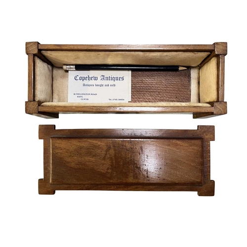 139 - An Arts & Crafts early 20th century walnut jewellery casket box in the form of a coffer chest. A... 