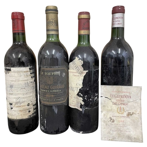 178 - A collection of four vintage 1980s French red wine bottles. The lot to include a Château Lagrange Mo... 