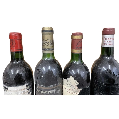 178 - A collection of four vintage 1980s French red wine bottles. The lot to include a Château Lagrange Mo... 