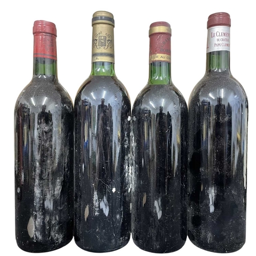 178 - A collection of four vintage 1980s French red wine bottles. The lot to include a Château Lagrange Mo... 