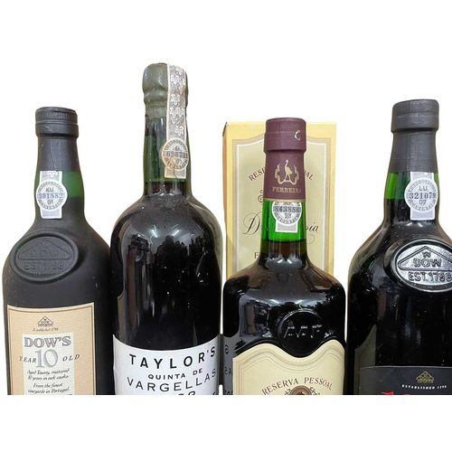 206 - An assortment of four vintage port bottles. The lot to include a Dona Antonia Reserva Pessoal Porto ... 