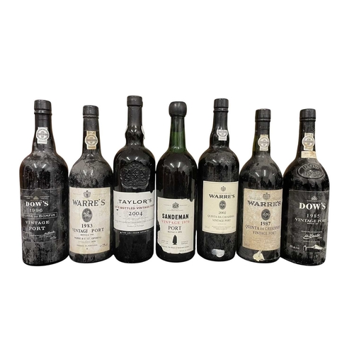 207 - An assortment of seven vintage Port bottles. The lot to include a Sandeman vintage 1970 port bottle,... 
