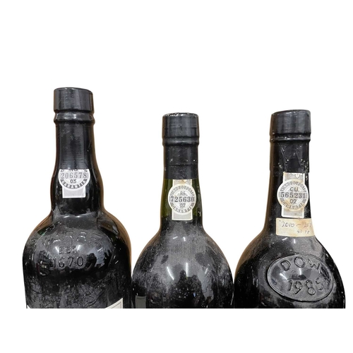 207 - An assortment of seven vintage Port bottles. The lot to include a Sandeman vintage 1970 port bottle,... 
