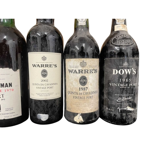 207 - An assortment of seven vintage Port bottles. The lot to include a Sandeman vintage 1970 port bottle,... 