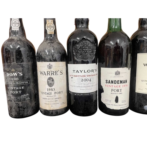 207 - An assortment of seven vintage Port bottles. The lot to include a Sandeman vintage 1970 port bottle,... 